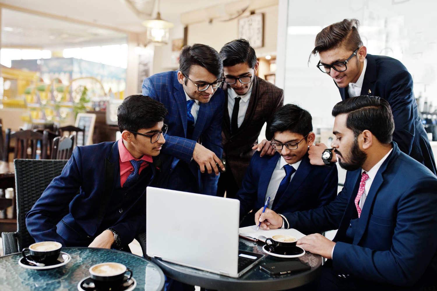 SAP consultants collaborating around a table as a delivery team